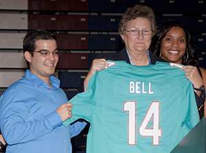 Dr. Jan Bell, Faculty Athletics Representative and longtime Director of Sports Administration Programs at St. Thomas University received a Miami Dolphins jersey with her name in commemoration of becoming the University's 10th  inductee into the Bobcat Sports Hall of Fame.