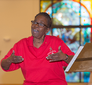 Donna Blyden leads the choir during the Black Catholic History Month Mass.