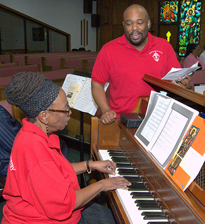 Robert Brown rehearses with Donna Blyden on piano.