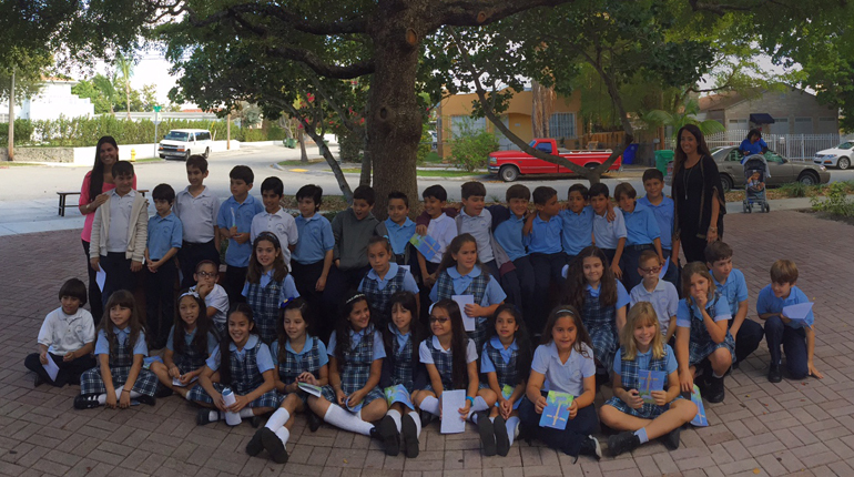 After receiving the sacrament of Reconciliation, Sts. Peter and Paul School students pose for a group photo outside the parish church. The third graders are close to receiving their first Communion.