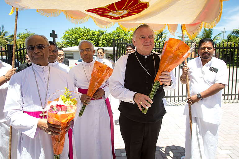 Miami Archbishop Thomas Wenski and visiting bishops from Chicago and India are welcomed by the Indian Catholic community of Florida gathered May 31 for the dedication of a new parish, St. Jude Knanaya Syro-Malabar Church in Fort Lauderdale.