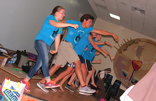 Student volunteers from Peoria's Notre Dame High School and Illinois State University, perform for the children before the closing of summer camp each day.