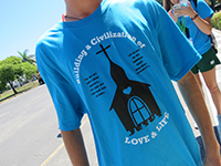 Inigo Isla, a member of the Apostles of the Two Hearts who work closely with the Servants of the Pierced Hearts, sports the summer camp T-shirt. Isla, a volunteer from Miami, said he feels like the students from Illinois are “family.”