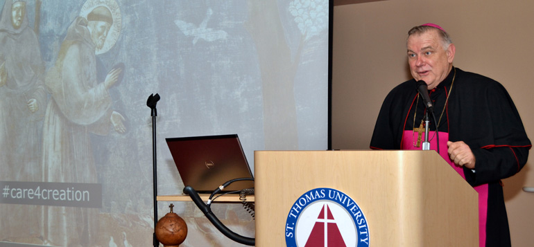 Archbishop Thomas Wenski discusses Pope Francis' encyclical Laudato Si' at freshmen convocation.