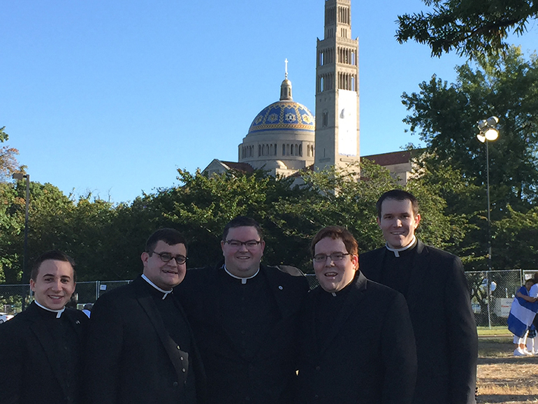 Florida seminarians pose outside the Basilica of the Immaculate Conception in Washington, D.C., before the Mass of canonization for Junipero Serra. From left: Michael Scaramuzzo II, Diocese of Venice; Caleb Harkleroad, Diocese of Savannah; Ryan Saunders and Andrew Tomonto, Archdiocese of Miami; and Thomas Pringle, Diocese of Orlando.