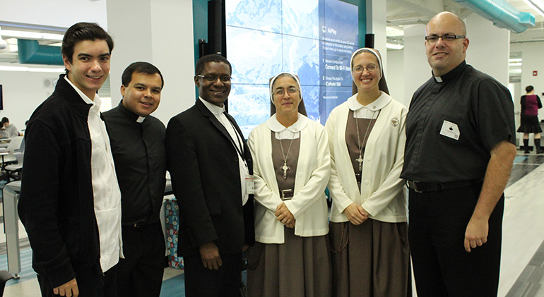 The Archbishop Edward McCarthy High vocations panel consisted of, from left: Andrew Vitrano, seminarian at St. John Vianney College Seminary in Miami; Father Elvis Gonzalez, director of vocations at the Archdiocese of Miami; Father Jean Jadotte, chaplain at Archbishop McCarthy High; Sisters Maria Jose Socias and Grace Heinrich of the Servants of the Pierced Hearts of Jesus and Mary; Dominican Father Cristobal Torres, Barry University chaplain; and Deacon John Clarke (not pictured) of the Respect Life Ministry.