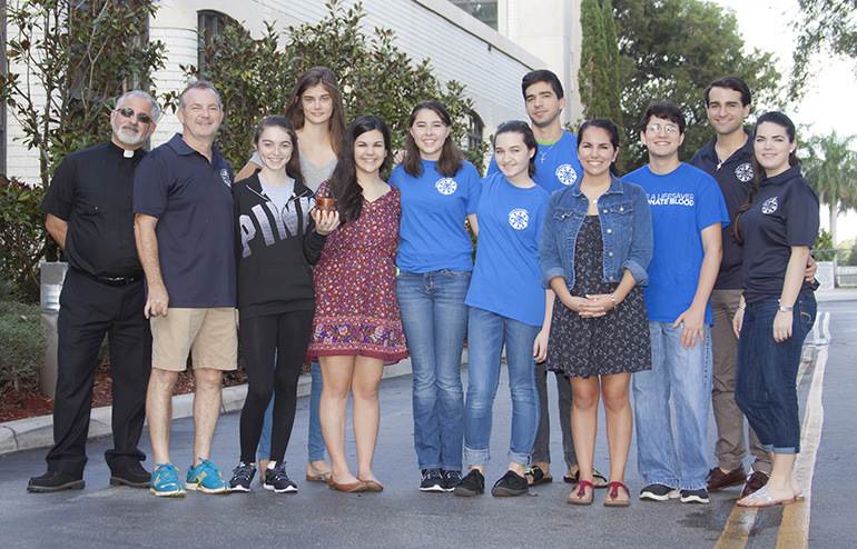 The St. Mark Youth Group spearheaded the effort to raise funds to repair the bells at the church located in Southwest Ranches. After two months of fundraising the group was able to raise ,000. From the left, St. Mark's parochial vicar, Father Juan Pedro Hernández-Alonso, Scott Czubkowski, Karina Czubkowski, Melanie Bertuccelli, Emily Lantigua, Andrea Garza, Sarah Roberge, Mathew De La Fe, Katherine Lantigua, Jose Tañon, Youth Ministry Director Gustavo De La Fé and Caitlin Lynch.