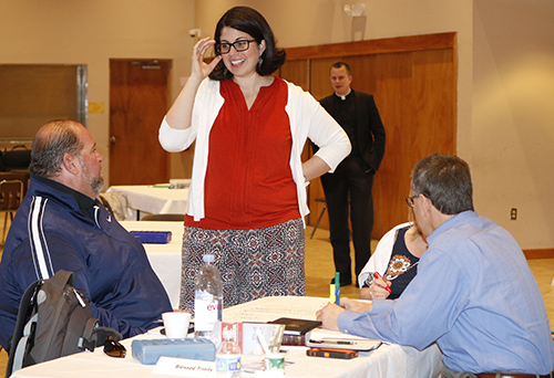 Alejandra Correa, of Emmanuel Community, chats with local parish leaders at the most recent "parish missionary disciples" training day.