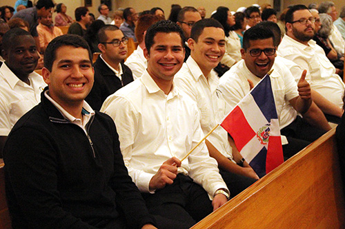 Seminarians from St. John Vianney College Seminary show their support and some Dominican Republic pride at the Mass celebrating Claretian Sister Eridania Reinoso's first profession of vows.