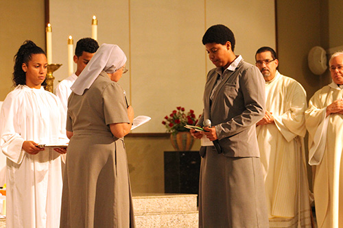 Sister Ondina Cortes, left, director of novices in Miami, officiates at Sister Eridania Reinoso's first profession of vows as a Claretian Missionary.