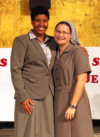 After sharing the journey as Claretian novices, Sister Ivette Habach (right) and Sister Eridania Reinoso pose after the Mass where Sister Eridania made her first profession of vows.