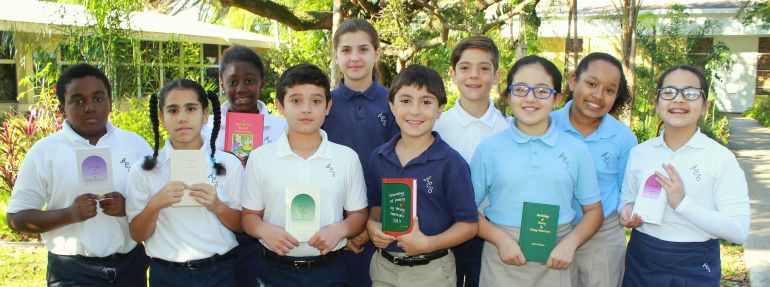 Fifth-graders at Annunciation School show copies of the "Anthology of Poetry by Young Americans," for which their poems have been accepted. In the back row are Claire Noel, Nina Galindo, Alessandro Ortega and Jazmyn Brown-Cieza. Front Row: Sebastian Eveillard, Damaris Perez, Juan Cepeda, Charles Geraci, Paulina Suarez and Sofia Giraldo.