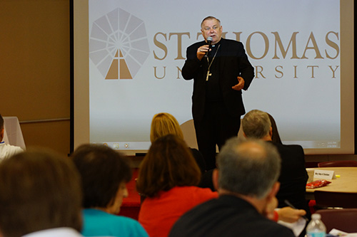 Archbishop Thomas Wenski speaks to parish leaders after they presented various plans of action for better evangelizing their communities.