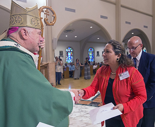 Alba Luz Bellini from St. Michael the Archangel Church in Miami is re-commissioned in worship ministry.