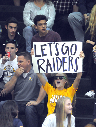 St. Thomas Aquinas fans cheer on their Raiders volleyball players.