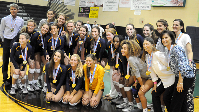 St. Thomas Aquinas team pose for a photo after their 25-17, 25-21, 25-21 victory over Tampa Plant in the Class 8A state volleyball championship match, their third consecutive state title and fifth overall in school history.