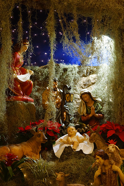 This Nativity scene adorned the altar during New Year's Eve midnight Mass at Notre Dame d'Haiti Church in Miami.