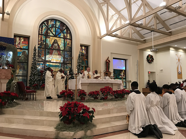 Archbishop Thomas Wenski celebrates New Year's Eve midnight Mass at Notre Dame d'Haiti Church in Miami. In addition to the solemnity of Mary, the Mass also marks the anniversary of Haiti's independence.