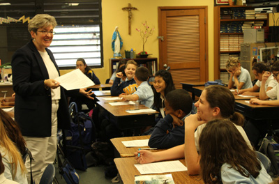 Nativity School teacher Lynne Moore engages students while they discuss George Washington's Rules of Civility and Decent Behavior In Company and Conversation. In Oct.2016, Moore participated in the George Washington Teacher Institute in Virginia to learn more about the life of the first president.