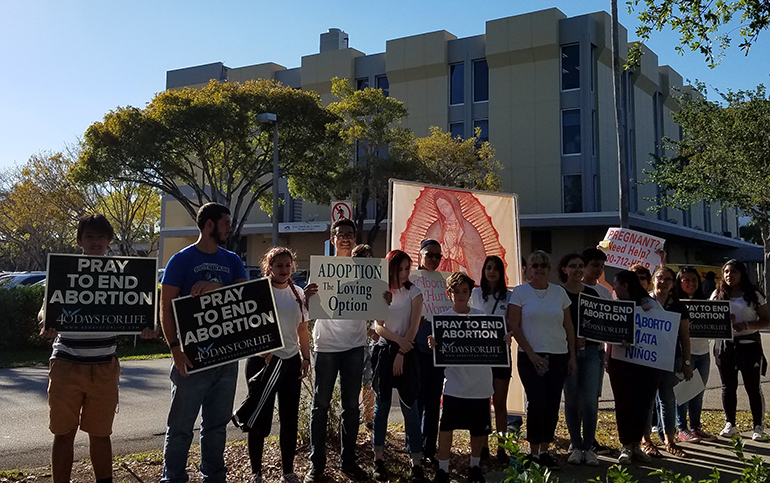 Members of St. Joachim's youth group keep vigil outside Eve Medical Center in Kendall April 7 during the 40 Days for Life 2017 campaign.