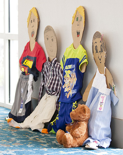 On display at the Miami Archdiocesan Council of Catholic Women's 59th annual convention were dozens of children's clothes which had been donated for needy children. The convention took place at the DoubleTree by Hilton in Deerfield Beach April 28-30.