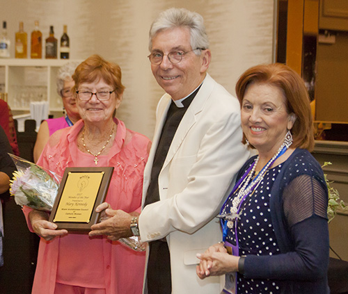 Father Michael J. Greer, pastor of Assumption Church in Lauderdale-By-The-Sea and spiritual advisor to the Miami Archdiocesan Council of Catholic Women, gives Mary Kennedy the 2017 MACCW Member of the Year award during the Miami Archdiocesan Council of Catholic Woman's 59th annual convention. At right is MACCW President Sharon Utterback. The convention took place April 28-30 at the DoubleTree by Hilton in Deerfield Beach.