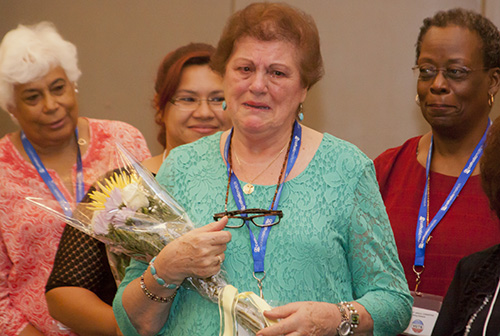 An emotional Nancy Nesselt realizes she is the recipient of the MACCW's highest honor, the Our Lady of Good Counsel Award, during the Miami Archdiocesan Council of Catholic Women's 58th annual convention, held April 28-30 at the DoubleTree by Hilton in Deerfield Beach.