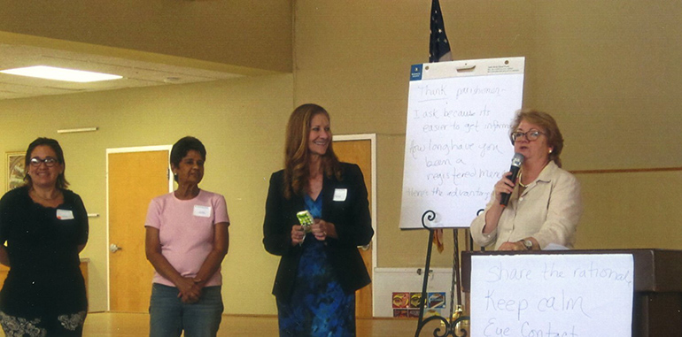 Grace Veloz of the Development Office speaks to participants at the Ambassadors of First Impression workshop held July 20 at St. Andrew Church, Coral Springs.