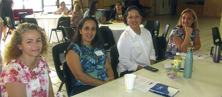 Smiling for the camera: some of the parish secretaries and other staff who took part in the Ambassadors of First Impression workshop held July 20 at St. Andrew Church, Coral Springs.