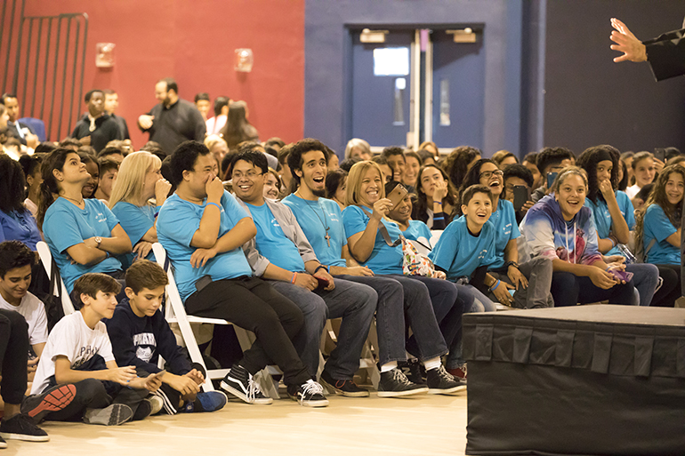 Students react to keynote speaker Father Tony Ricard, pastor of St. Gabriel the Archangel and campus minister/theology teacher at St. Augustine High School in the Archdiocese of New Orleans.  Approximately 700 teenagers attended Mercy Night 2017 at St. Thomas University in Miami Gardens.