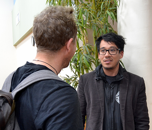 Speaker Matt Fradd talks with Juan Alarcon of St. Cecilia Parish after Fradd's talk on online pornography, May 19 at the Pastoral Center.