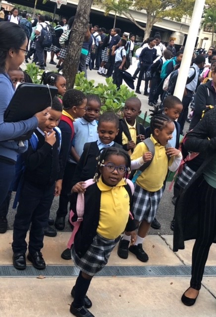 Students arrive for school at St. James in North Miami, which has seen a resurgence in enrollment over the past five years. St. James has 410 students on scholarship, up from 302 five years ago. About 90 percent are of Haitian descent. The vast majority of their parents would not have been able to afford tuition without the scholarship. Most are paying $ 500 to $ 600 a year with it.