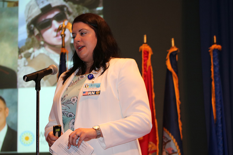 Elyce Bishop, a medical professional at Holy Cross Hospital in Fort Lauderdale, delivers opening remarks March 6, 2020 during ceremonies marking the official start of a new health program for active military and veterans. Bishop's husband currently serves in the Navy.