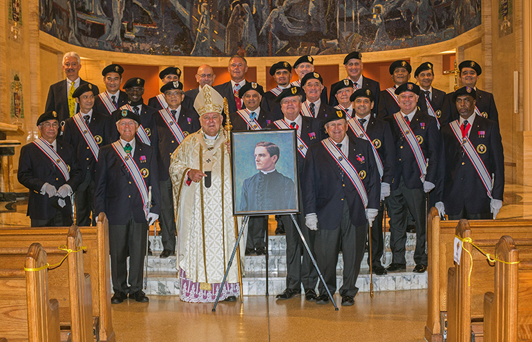 Archbishop Thomas Wenski poses with the Knights of Columbus at St. Mary Cathedral after celebrating a Mass to mark the beatification of their founder, Father Michael McGivney, Oct. 31, 2020.