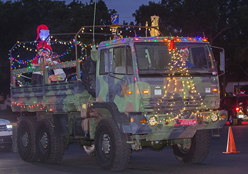 First place winner at St. Rose of Lima Church and School's Christmas carline parade, Dec. 17, 2020: the Burzenski family and their decorated military truck.