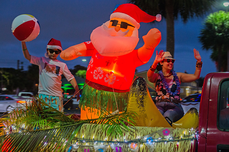 Domenic Stimson, 8, a second grader at St. Rose of Lima School, and his mother, Clarissa Stimson, take part in the Christmas parade Dec. 17, 2020.