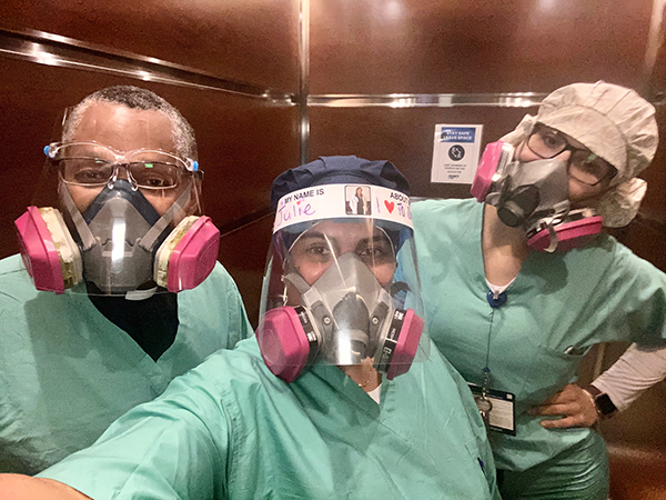 Father J. Sterling Laurent, a priest chaplain at Miami's Mercy Hospital for the past nine years, and a priest in residence at nearby St. Kieran Parish, takes a selfie with some of the medical staff at Mercy, all outfitted in protective gear during  the COVID-19 pandemic.