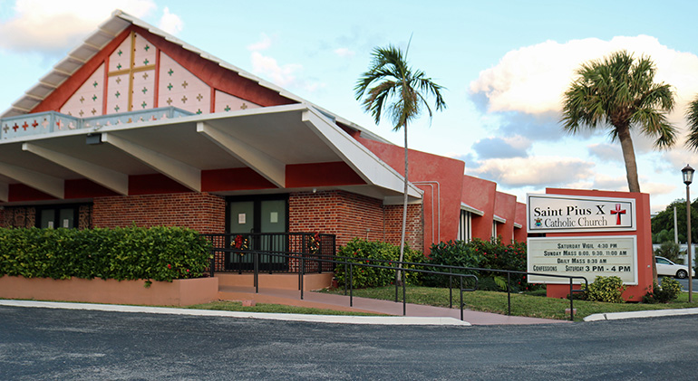 Exterior of St. Pius Church X in Fort Lauderdale, where barcodes linking to Mass readings and hymns help parishioners participate more fully in the celebrations, both in person and from home.