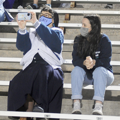 Immaculate Heart of Mary Sister Carmen Fernandez, president of Lourdes Academy, takes a video of the Bobcats while another student watches during the first half of Our Lady of Lourdes Academy's 0-0, 3-1 penalty-kicks loss to Venice, March 5, 2021 in the FHSAA Class 6A Girls Soccer Championship Game at Spec Martin Stadium in DeLand.