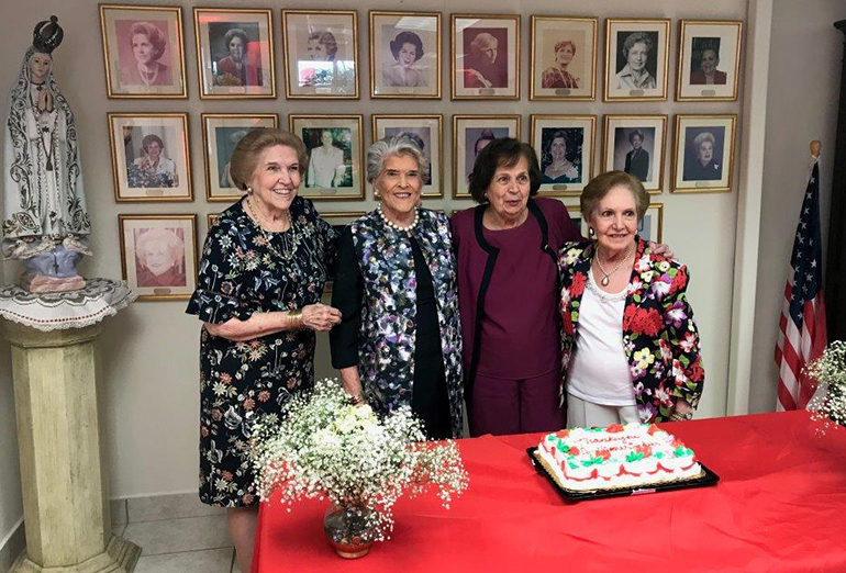 Centro Hispano Catolico Ladies Auxiliary first president Emma McCormack, far left, poses alongside the group's last president, Esperanza Rollan, and other members in a 2018 gathering in their offices located behind Centro Hispano in Wynwood.