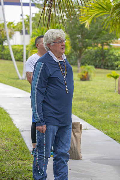 Faithful pray the rosary around the Mary Grotto at MorningStar Renewal Center in Pinecrest June 19, 2021. The ceremony was part of the Father's Day rosary and eucharistic procession.