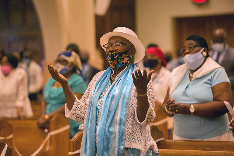 DuBienna Maurice sings during Mass at St. Mary Cathedral on the feast of the Assumption, Aug. 15, 2021, a day after a 7.2 earthquake killed nearly 1,300 people in Haiti's southwestern peninsula. 
She was one of those in attendance at the Mass Archbishop Thomas Wenski celebrated to pray especially for the earthquake victims.