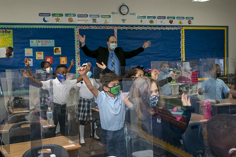 Jim Rigg, archdiocesan schools superintendent, dances to "Happy" with second graders at St. Lawrence School on the first day of the 2021-22 school year, Aug. 18, 2021. 

The new superintendent spent his first morning of the 2021-22 school year greeting students coming for their first day of class at St. Lawrence School in North Miami Beach.