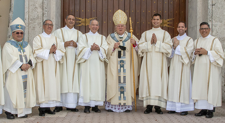 Deacons pose with Archbishop Thomas Wenski after their ordination, from left: Auxiliary Bishop Enrique Delgado; newly ordained Deacons Jose David Mercado, Inran Emilio Infante, and Francisco Alvarez-Gil; the archbishop; newly ordained Deacons Enzo Rosario Prendes, Ramon David Gonzalez and Erick Jose Cinco.


Archbishop Thomas Wenski ordained six deacons Dec. 18, 2021 at St. Mary Cathedral. Five of them are married men, or permanent deacons, one is a transitional deacon, who ultimately will be ordained a priest.