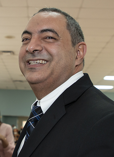 Newly ordained Deacon Emilio Infante smiles while greeting well-wishers after the ceremony. A few minutes earlier he had been informed that he will be a grandfather for the second time.