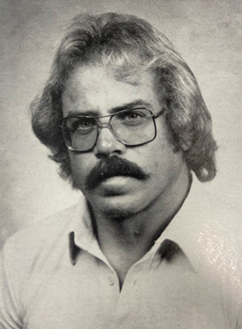 Yearbook photo of St. Thomas Aquinas' longtime athletic director and football coach, George Smith, from the days when he started out at St. Thomas as a physical education teacher.