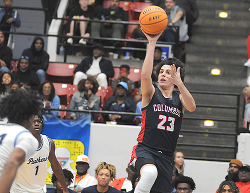 Columbus guard Benny Fragela shoots over the Dr. Phillips defense in Columbus' 45-44 victory over defending state champion Dr. Phillips, March 5, 2022, in the FHSAA Class 7A state boys basketball championship game at RP Funding Center in Lakeland.