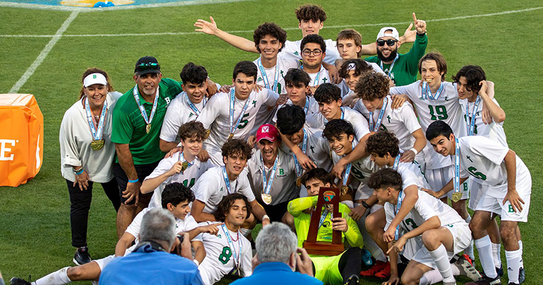 St. Brendan High School's boys soccer team celebrate after winning the school's first ever state championship in that sport with a 1-0 defeat of Orlando's Bishop Moore, Feb. 24, 2022.