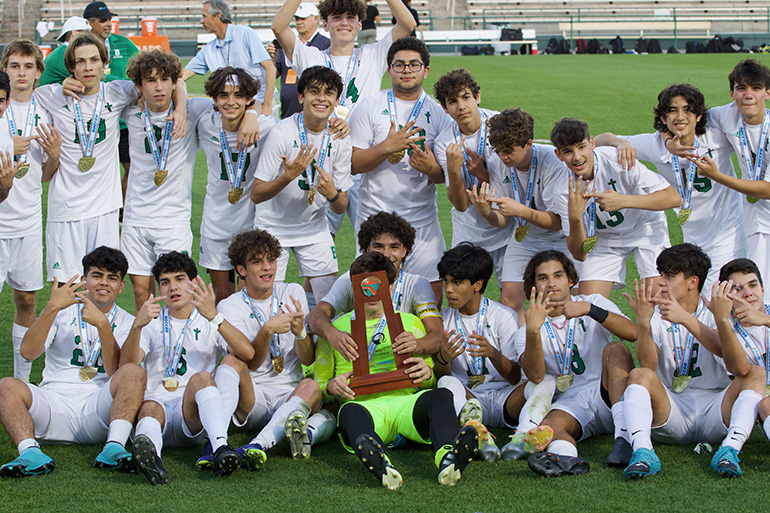 St. Brendan High School's boys soccer team celebrate after winning the school's first ever state championship in that sport with a 1-0 defeat of Orlando's Bishop Moore, Feb. 24, 2022.