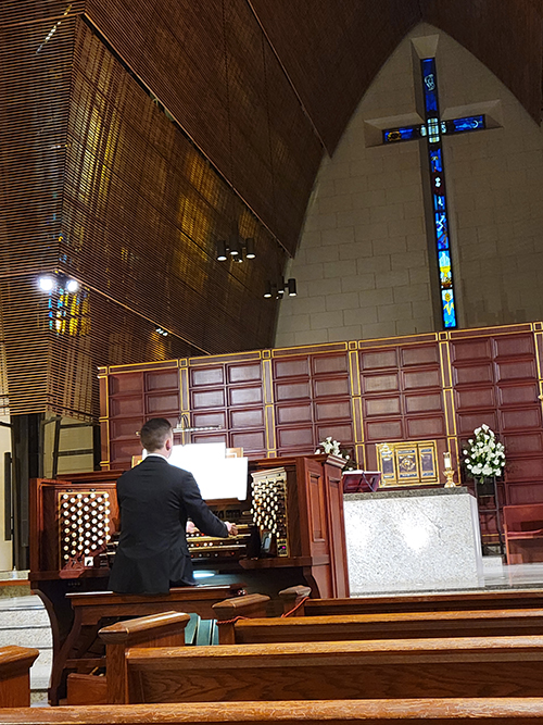 International and national award winning organist David Baskeyfield plays the Frattelli Ruffatti organ console set at the foot of the altar at Epiphany Church in Miami. On Feb. 24, 2022, he played the first organ concert since the pandemic stopped all performances at the church.